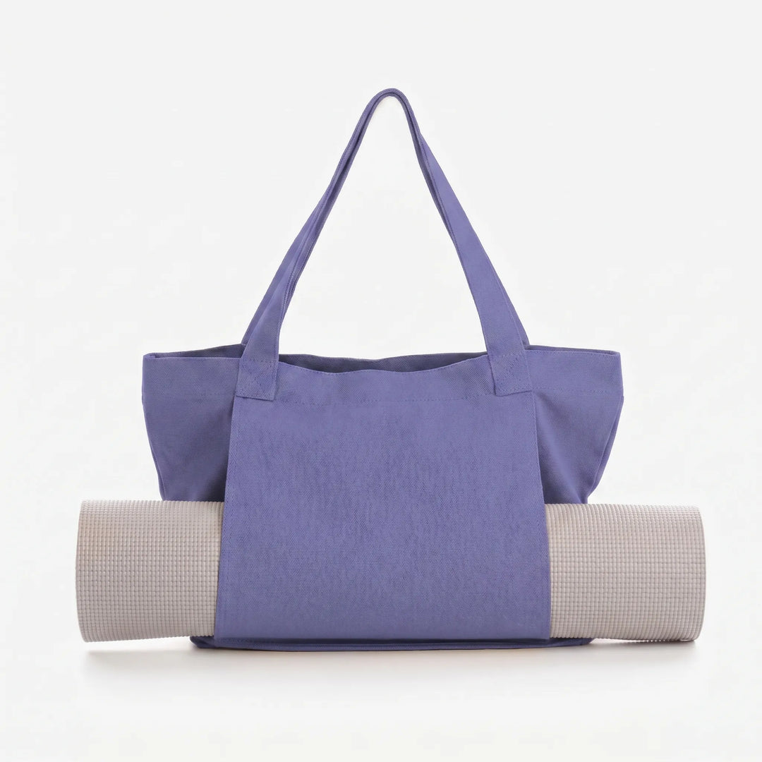 Hands-free yoga mat tote bag for easy transport, ample storage for all your fitness gear and accessories.