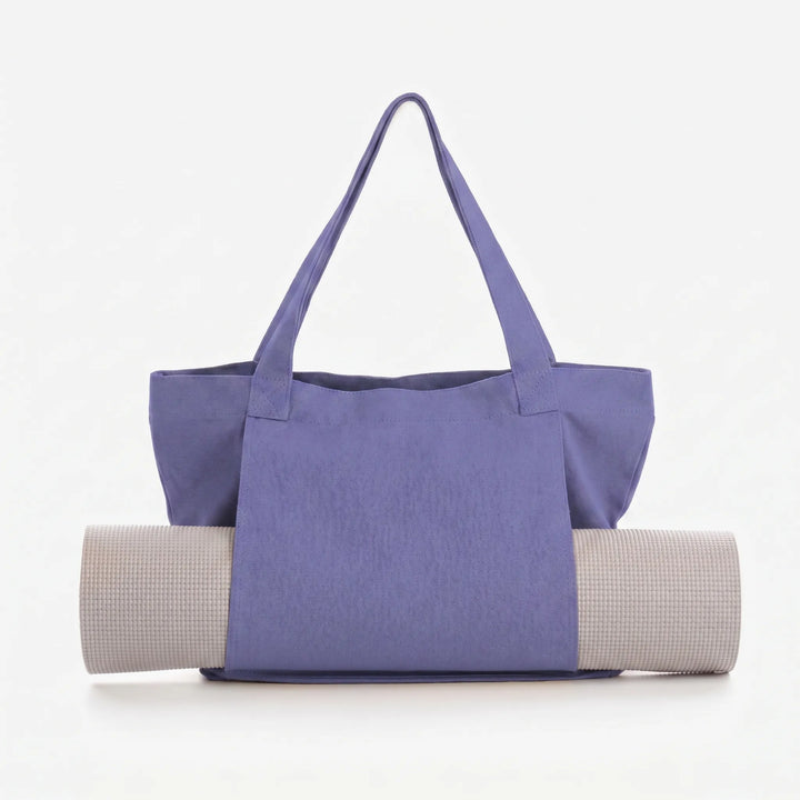 Hands-free yoga mat tote bag for easy transport, ample storage for all your fitness gear and accessories.