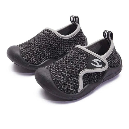 Top-down view of comfortable unisex children's shoes with non-slip, flexible soles.