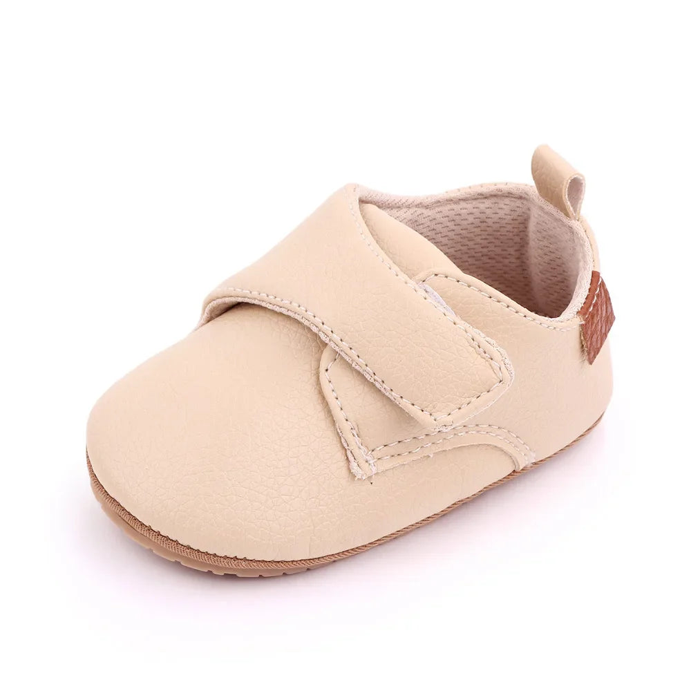Unisex classic black leather baby anti-slip first walker shoes, essential infant footwear