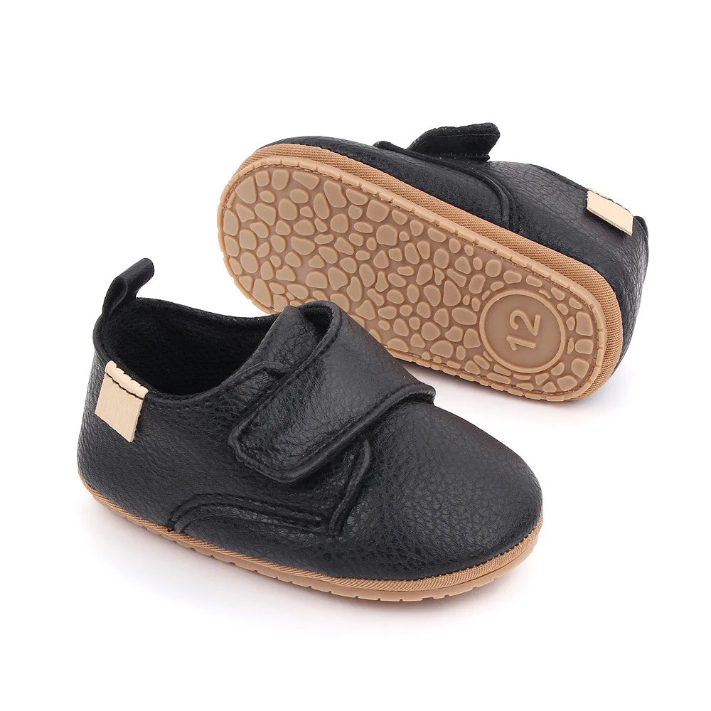 Detailed view of sole on classic leather baby anti-slip first walker shoes, good grip