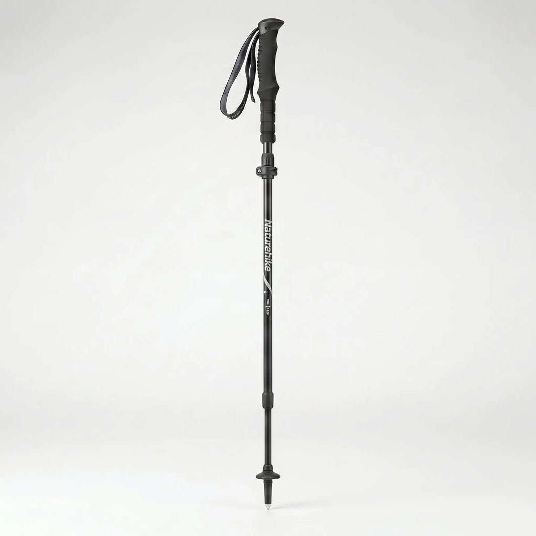 Ergonomic handle & quick-lock mechanism of a compact folding trekking pole, durable outdoor hiking gear.