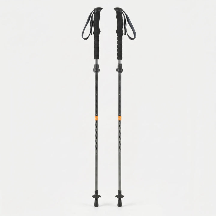 Folding trekking pole attached to a backpack, ready for lightweight hiking & trail adventures as compact gear.