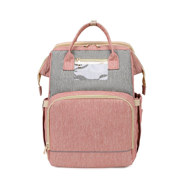 Stylish unisex mom/dad bag. Converts to a portable changing station & travel crib for easy outings.