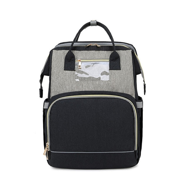 Durable water-resistant diaper bag. Multifunctional as a portable changing station & travel crib.
