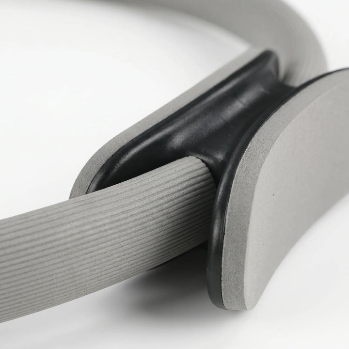 Pilates resistance ring for muscle toning, core exercises, and strength training. Essential home gym workout equipment.
