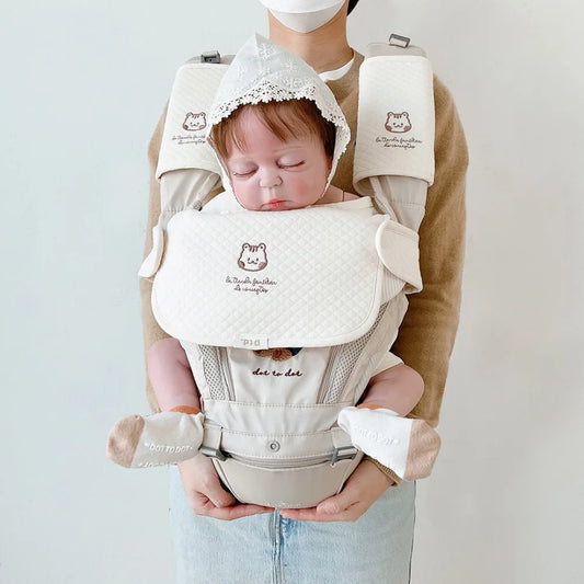 Close-up of a white cotton baby bib with snap closure, ideal for infant feeding.