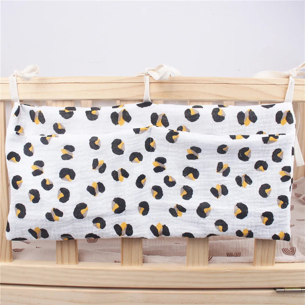 Soft cotton crib organizer for nursery; holds diapers, wipes, creams