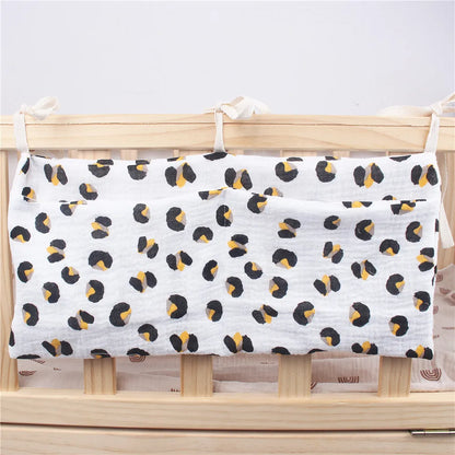 Soft cotton crib organizer for nursery; holds diapers, wipes, creams
