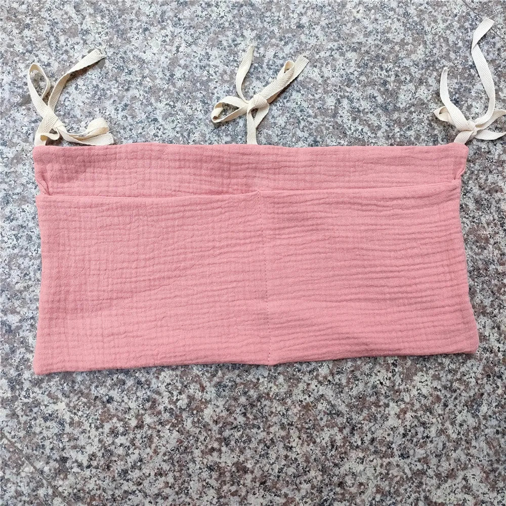 Neutral crib caddy, hanging, for all your baby's essential items