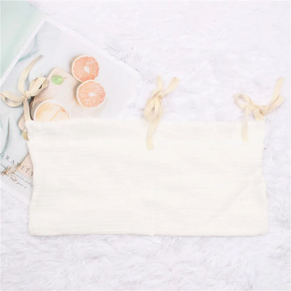 Space-saving crib organizer, ideal for newborn essentials and feeding