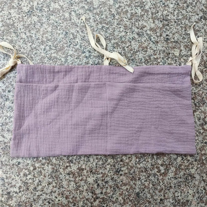 Soft cotton baby organizer, ideal for keeping newborn items tidy in crib