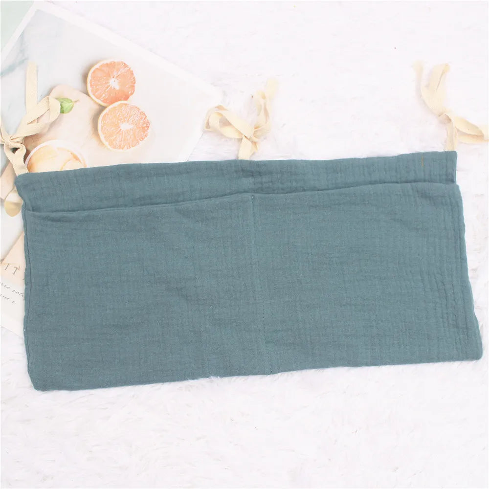 Baby bag-style crib organizer, fits toys, bottles, and changing items