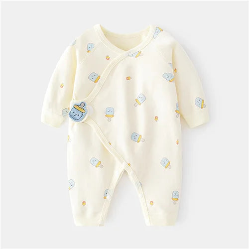 Newborn in a unisex cotton romper, sleeping peacefully, emphasizing comfort and softness