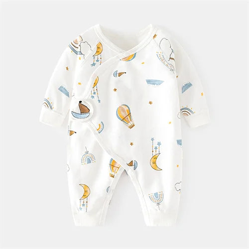 Baby wearing a unisex print cotton romper, smiling, showing happy, comfortable infant