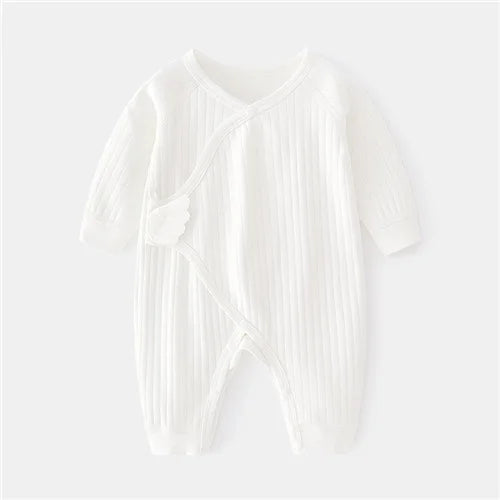 Back view of unisex cotton newborn romper, plain back with print detail on sleeves and front
