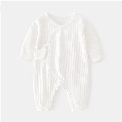 Back view of unisex cotton newborn romper, plain back with print detail on sleeves and front