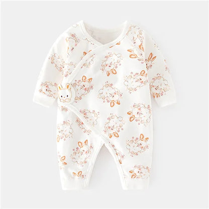 Group of assorted unisex cotton newborn rompers with various soft prints, baby clothing collection