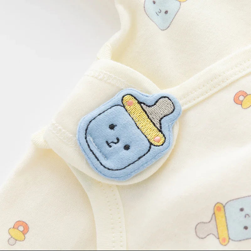 Unisex baby romper in organic cotton, full length one-piece for infants with snap closures