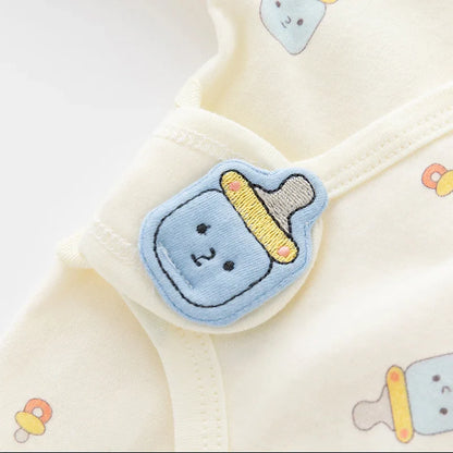 Unisex baby romper in organic cotton, full length one-piece for infants with snap closures
