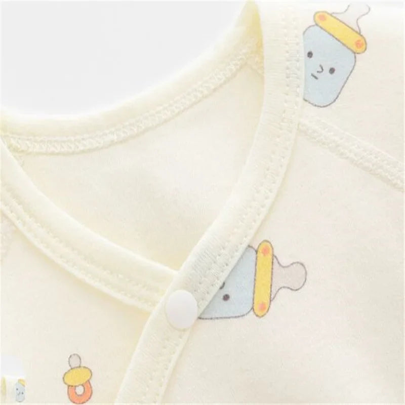 Newborn jumpsuit for baby boy or girl, comfortable, breathable cotton, lifestyle shot on a baby