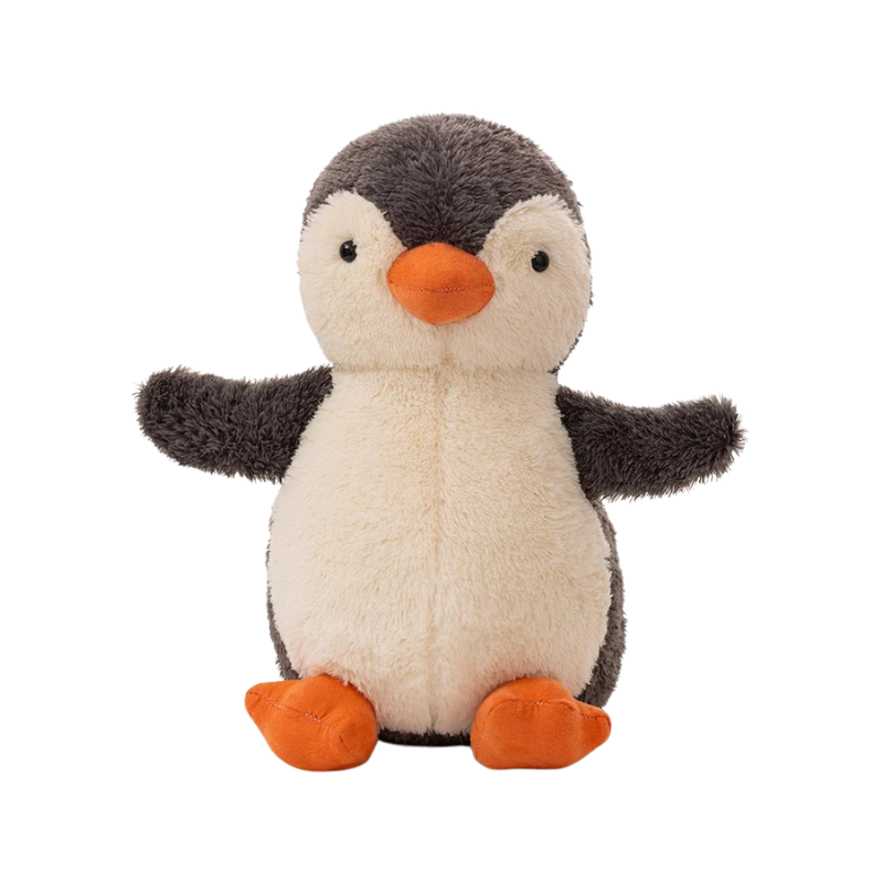 Kids' comfort toy: Cozy Penguin Plush smiling, made for cuddles and bedtime stress relief