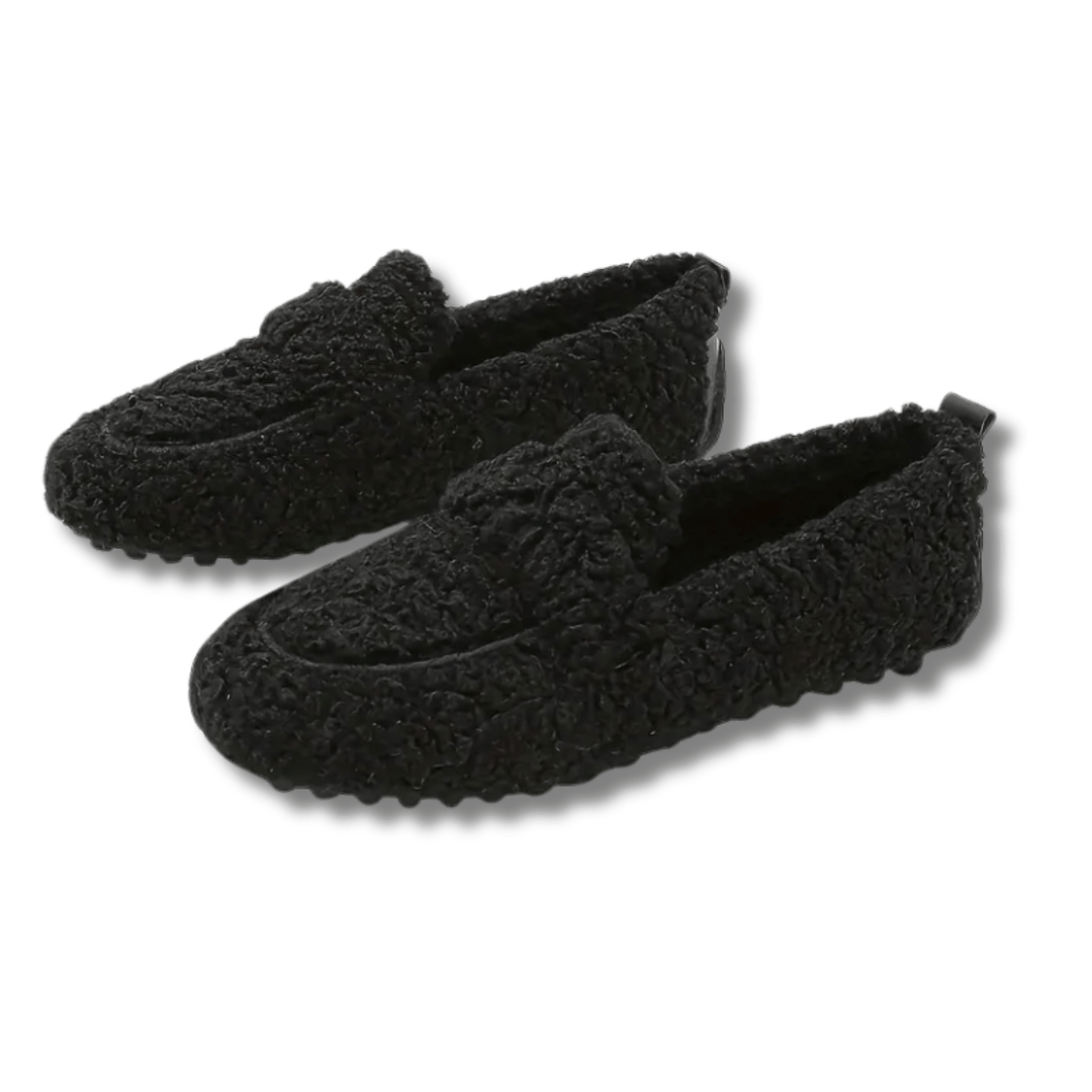 Plush unisex house shoes, ensuring cozy home comfort and warmth during winter.