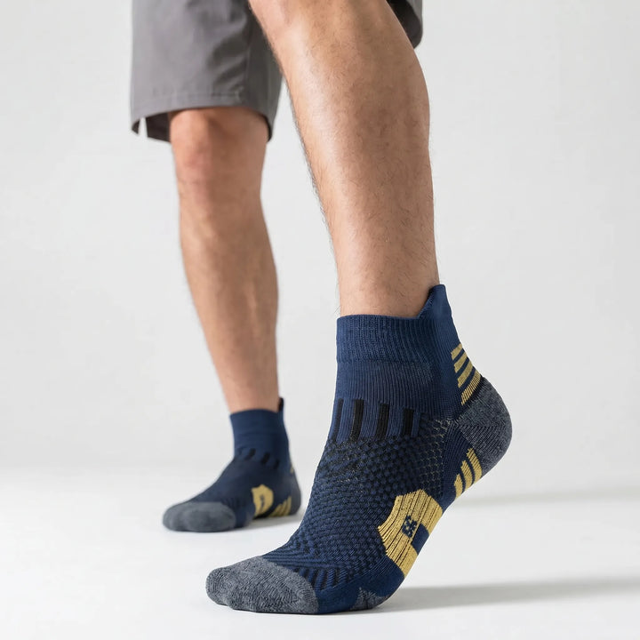 Pair of unisex cushioned ankle sports socks, showing ribbed arch support & reinforced heel. Great for active training.