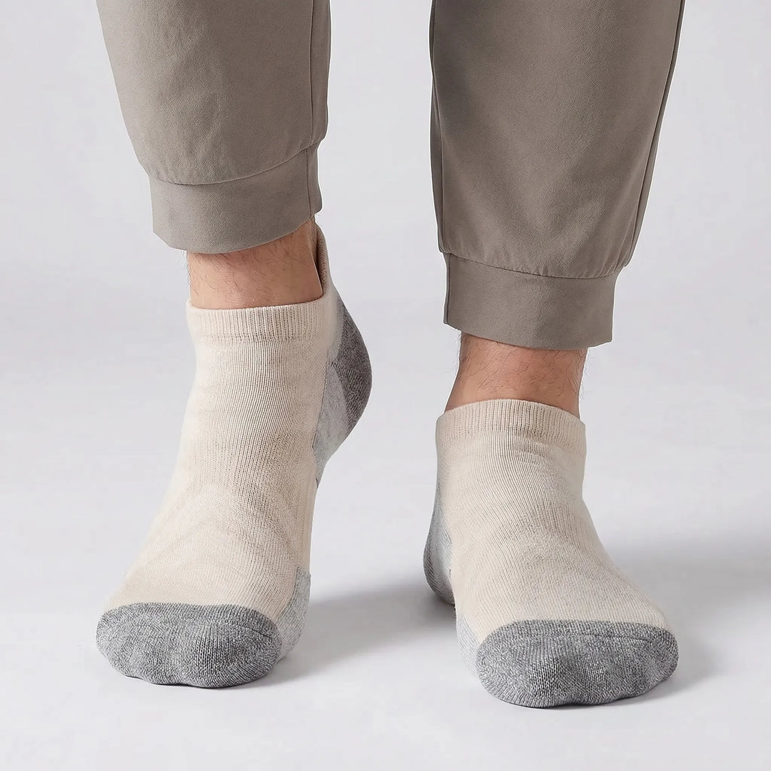 Performance no-show ankle socks with premium merino wool cushioning for runners & hikers. Unisex design.