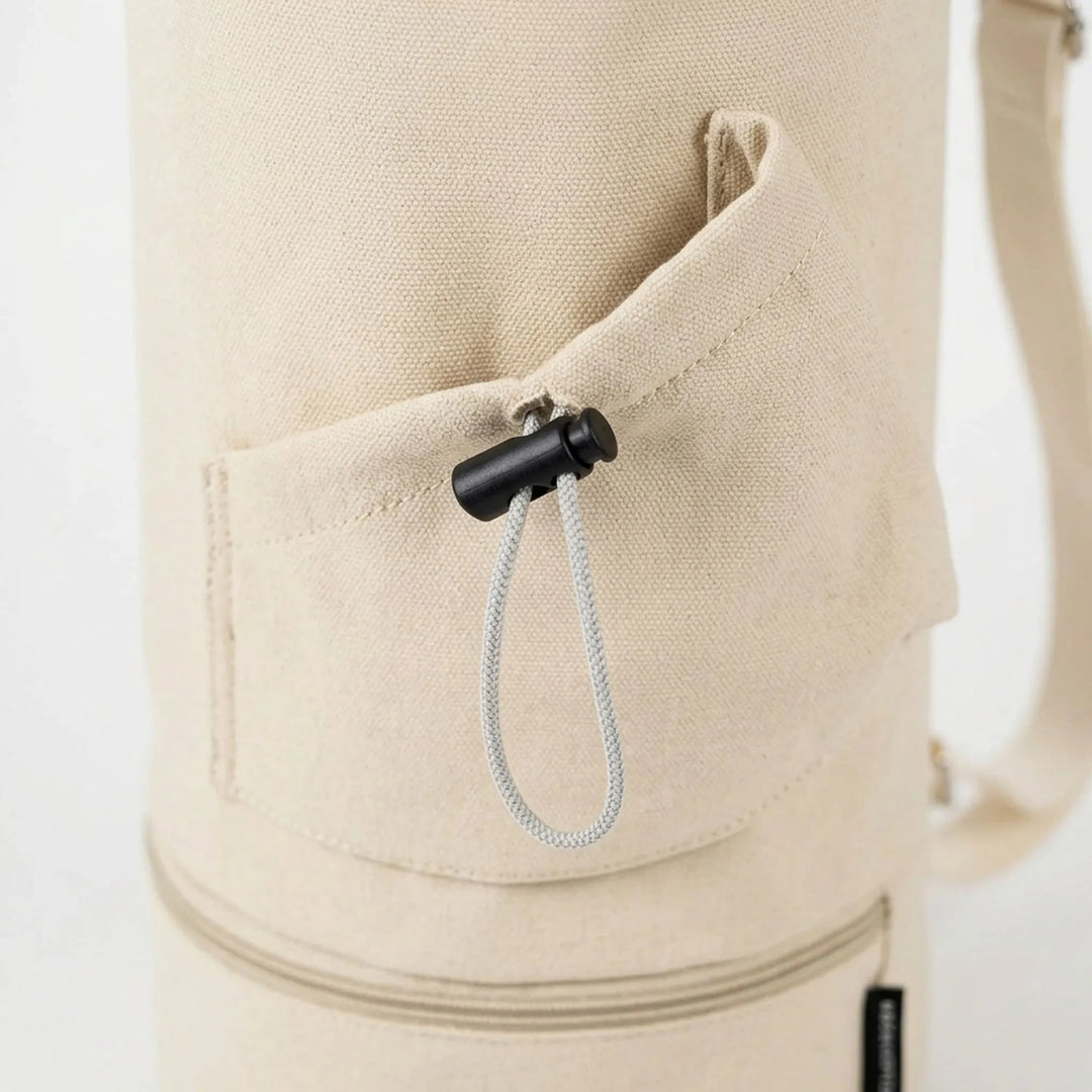 Beige yoga mat carrier bag, a practical fitness accessory for an active lifestyle.