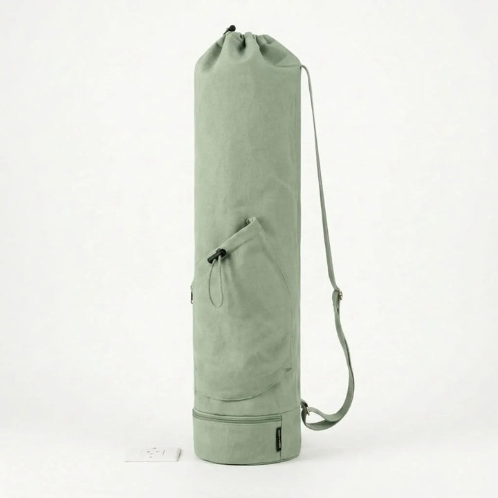 Durable cylindrical yoga mat carrier with secure zipper, perfect for all yoga gear.