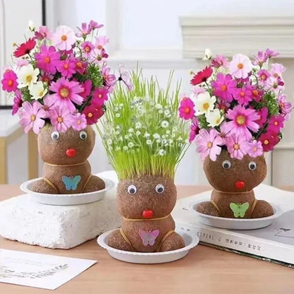 Unisex Grass Head kit on a wooden desk, a decorative houseplant bringing nature to home decor