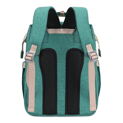 Diaper bag backpack converting into a portable crib, ideal for baby travel and nursery.