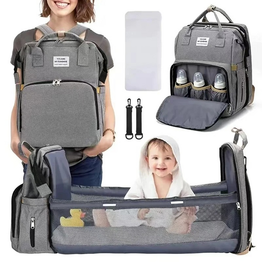 Unisex diaper bag backpack with integrated portable changing station, ideal for baby travel.