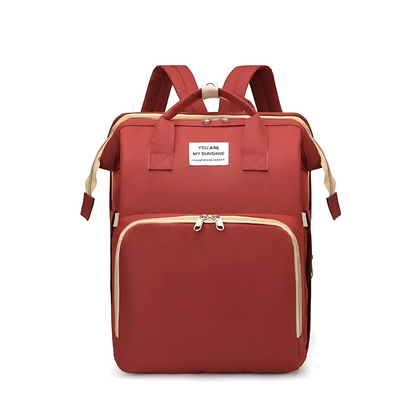 Interior of diaper bag backpack showing organized storage for baby essentials and personal items.