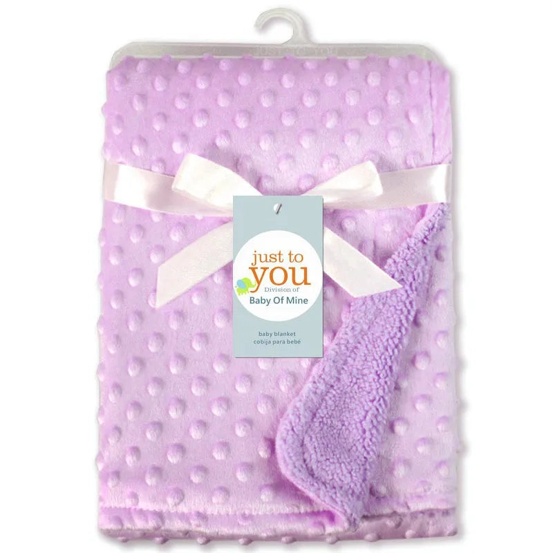 Unisex double layer cotton baby blanket, showcasing its versatility for swaddling, cuddling, and more.