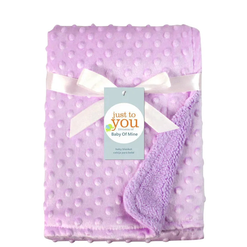 Folded double layer cotton baby blanket, a cozy and essential baby bedding item, great for gifting.