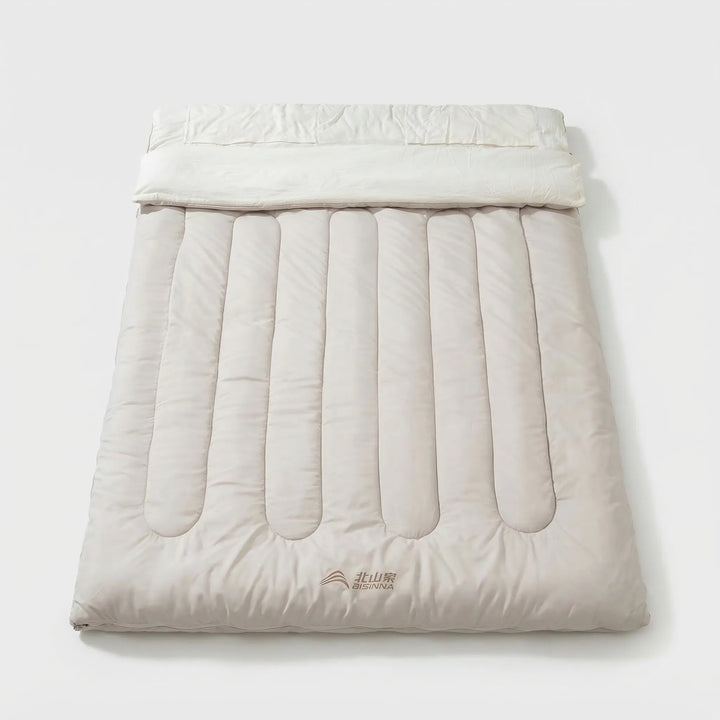 Durable unisex double sleeping bag, detachable for camping, hiking, and travel. Essential outdoor gear for warmth & comfort.