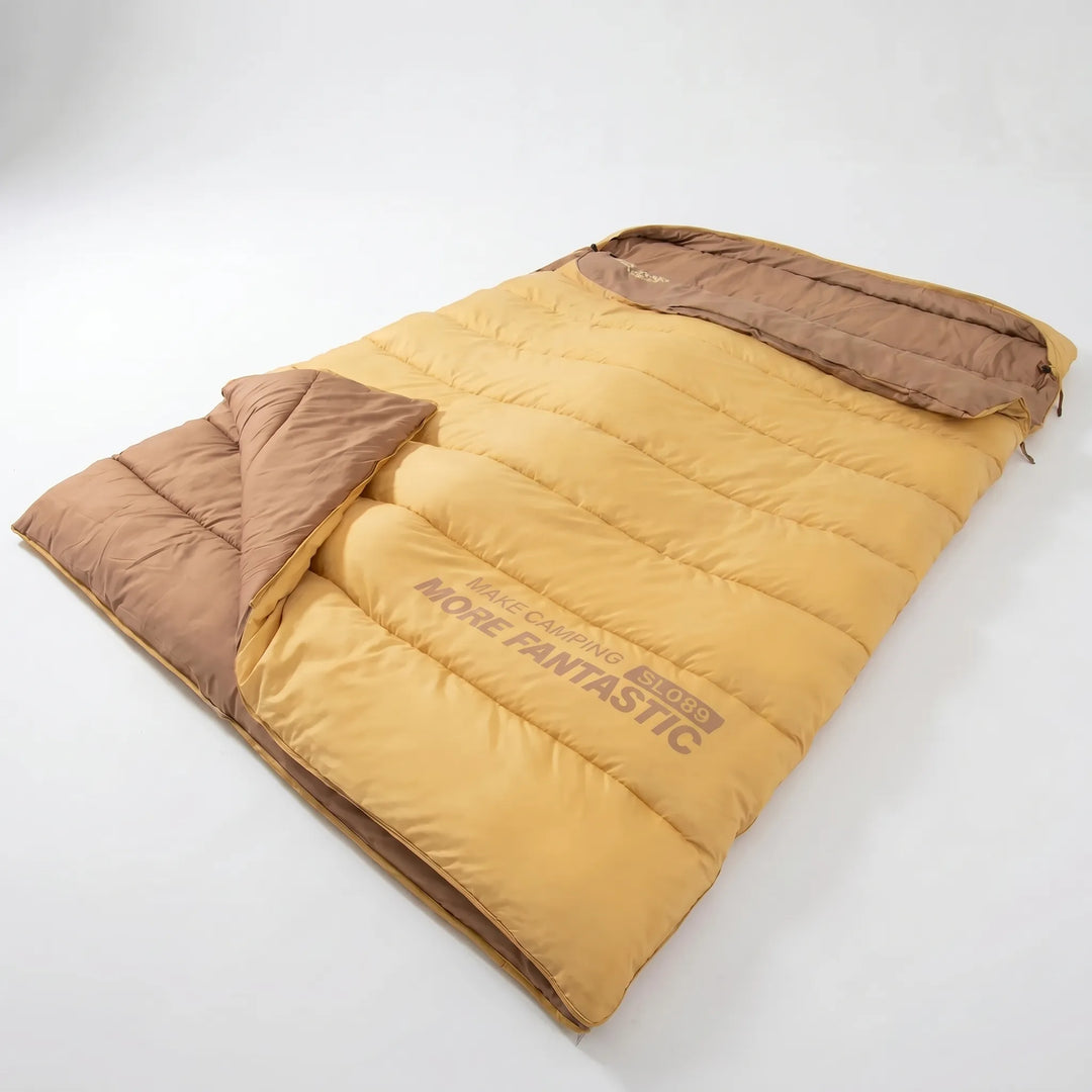 Yellow & brown double sleeping bag, lightweight & portable for 4-season camping and hiking trips.