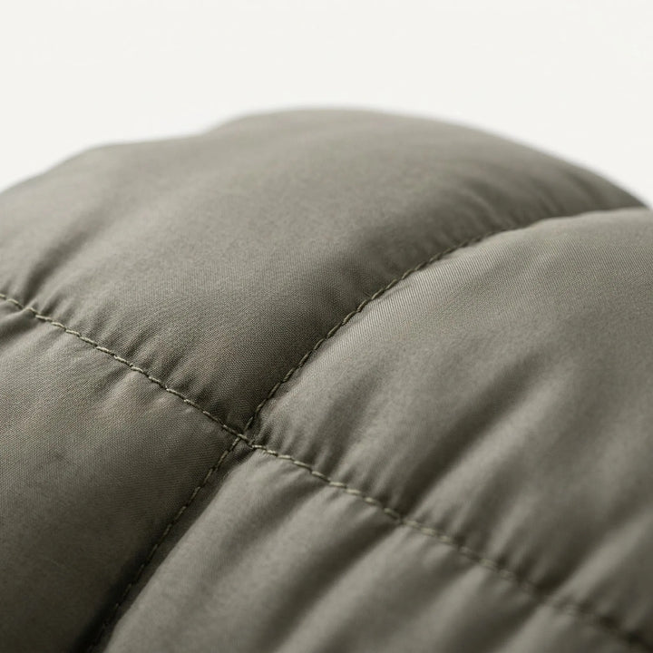 Compact unisex envelope sleeping bag. Versatile design for camping, hiking, & outdoor adventures. Cotton fill.