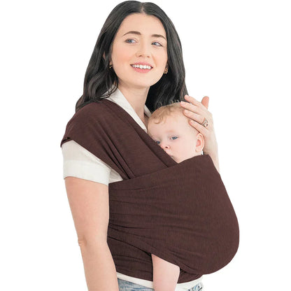 Close-up of a baby snug in an ergonomic baby carrier wrap, showing breathable fabric detail