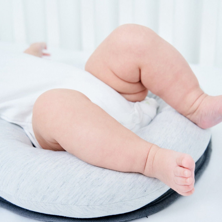 Close-up of soft, breathable fabric in ergonomic baby sleep nest, gentle for infant skin