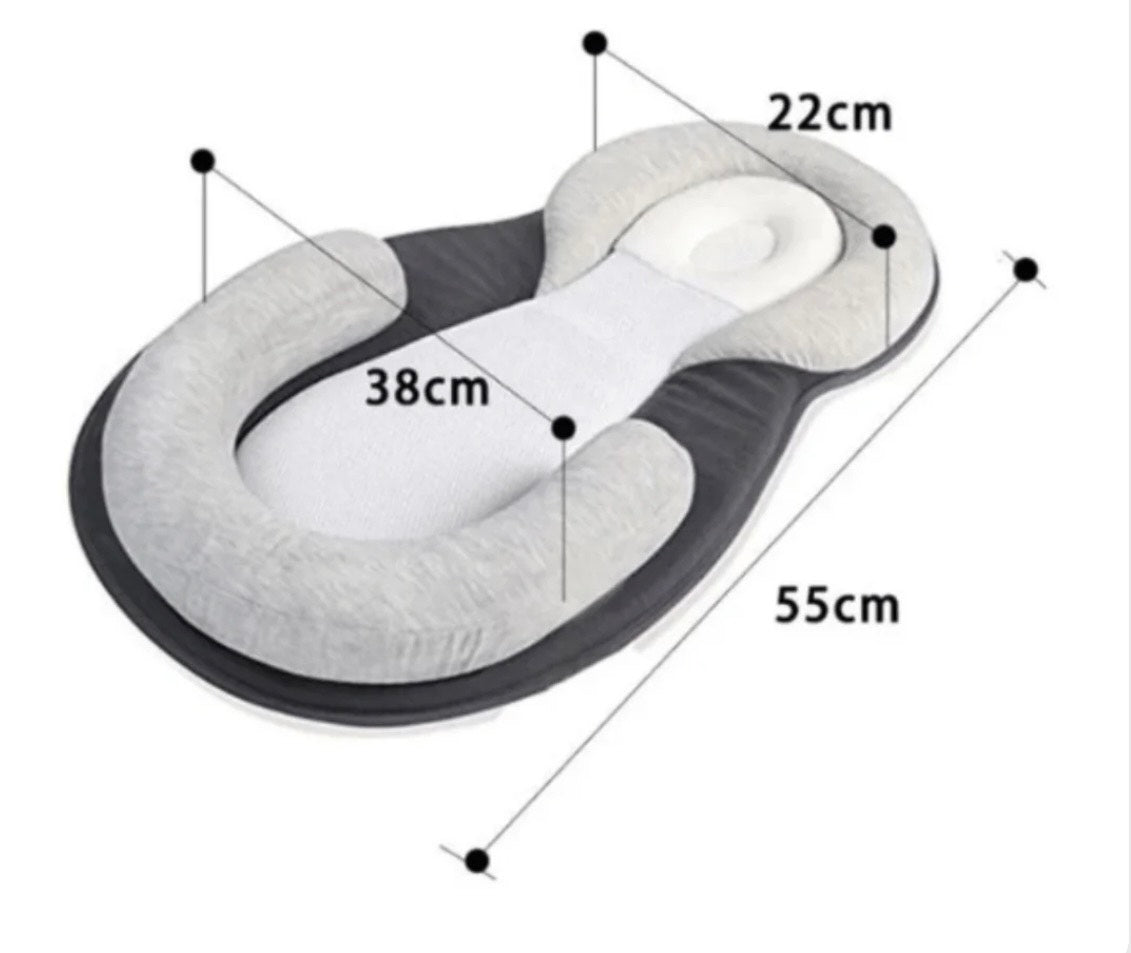 White baby sleep nest, portable and lightweight, perfect for travel or bedside use for newborns
