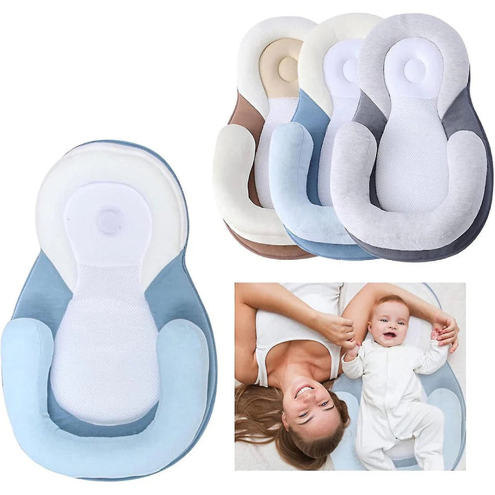 Overhead view of an empty unisex ergonomic baby sleep nest, clean and ready for infant