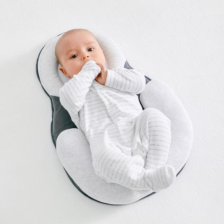 Unisex ergonomic baby sleep positioner bed for safe infant sleep & flat head prevention.