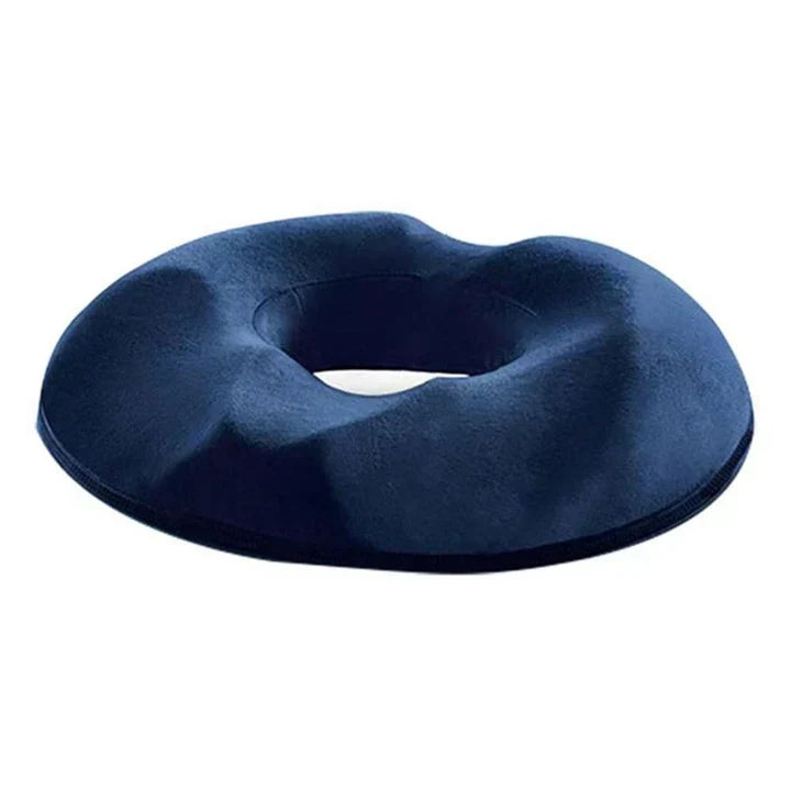 Donut-shaped ergonomic seat cushion designed for tailbone pressure relief & back pain reduction. Unisex memory foam.