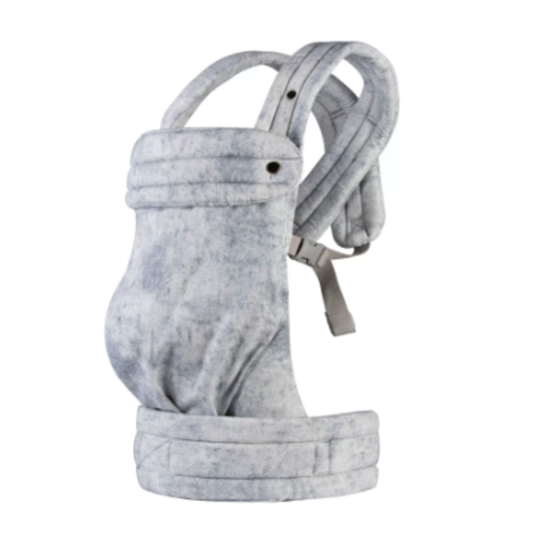 Newborn nestled safely in an ergonomic Mei Tai baby sling, promoting bonding