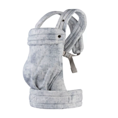 Newborn nestled safely in an ergonomic Mei Tai baby sling, promoting bonding