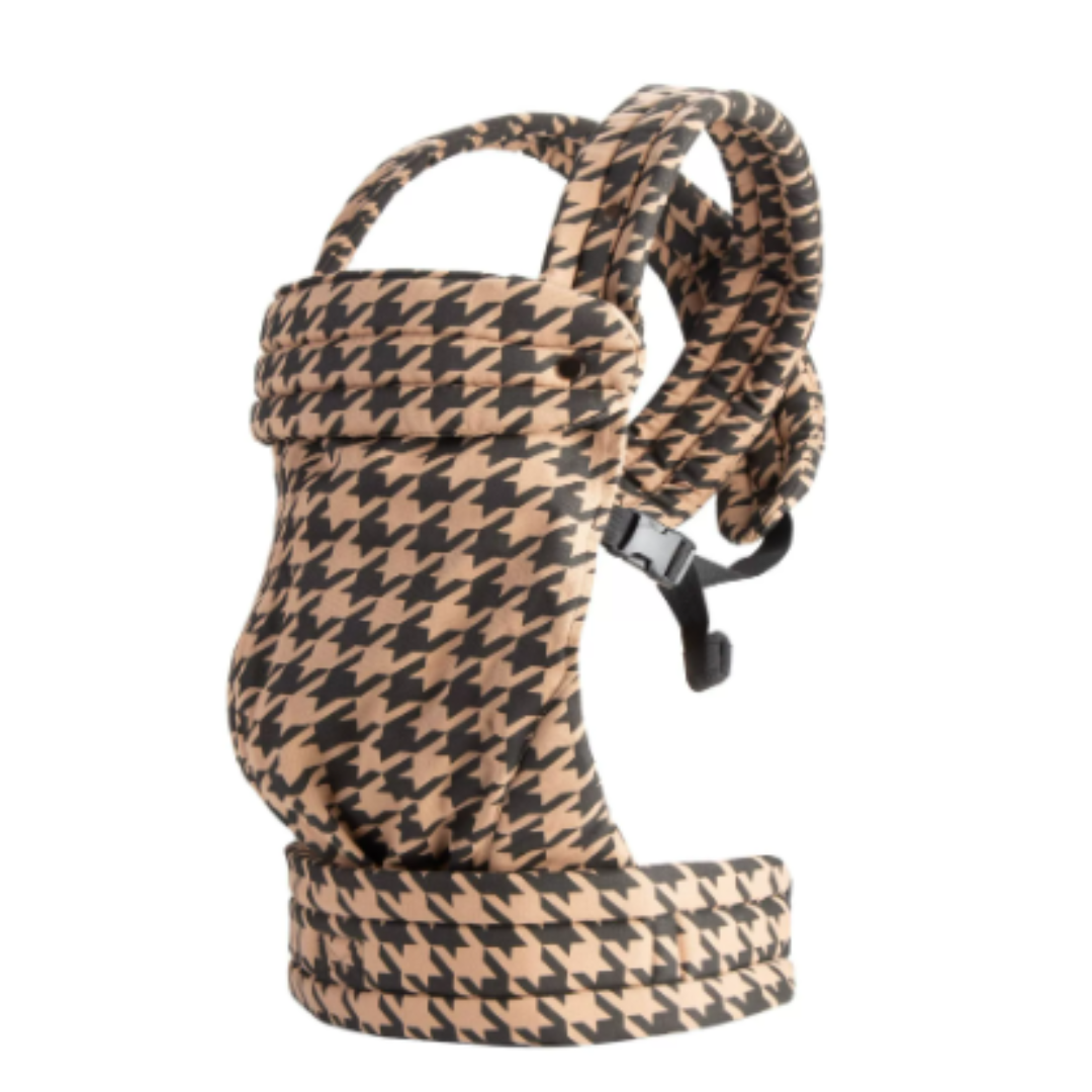 Adjustable Mei Tai baby carrier in a lifestyle shot, showcasing outdoor use by parents