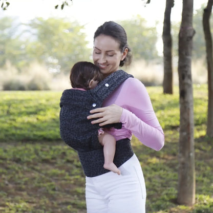 Detail of the ergonomic support in a Mei Tai baby sling for infant hip health